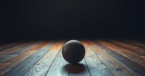 A solitary football in a dimly lit room, symbolising introspection and transition in a famed athlete's life.