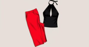 A stylish black halterneck top with daring slit, paired with bright red wide-leg trousers on a vibrant background.