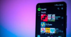A dramatic scene depicting a blurred Spotify interface with vibrant playlists under a moody lighting.