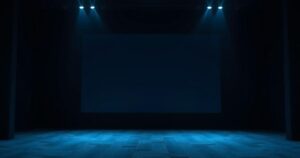 Silhouette of an empty cinema hall with dim lighting and a prominent screen, evoking a sense of unease.