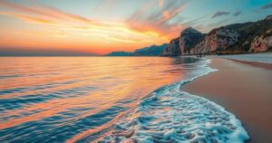 Scenic view of a tranquil beach in Mallorca, Spain, with soft waves and gentle sunlight creating a warm atmosphere.