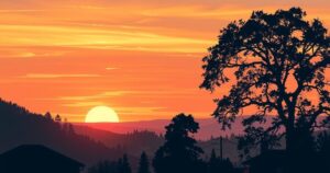 A serene landscape depicting a sunset over a quiet town, symbolising hope and new beginnings.